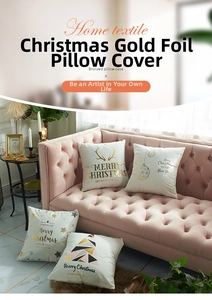 Detail of four festive bronzed Christmas cushion covers on a soft pink velvet sofa
