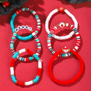 Detail of Christmas beaded bracelet set with clay discs and festive Merry charms