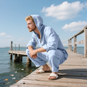 Macro detail of light blue linen texture on hooded shirt and pants set for beach wear