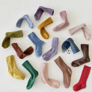 Detailed view of colorful ribbed cotton socks for kids featuring soft vertical knit texture