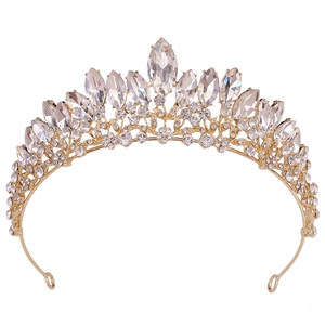 Close-up of golden bridal crown with sparkling crystal marquise and round rhinestones