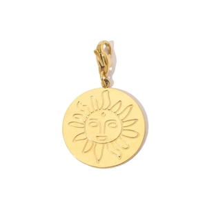 Detail of gold sun face pendant with lobster clasp and cubic zirconia on stainless steel