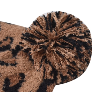 Fashionable leopard print knit beanie with fluffy pom-pom and ribbed cuff for women