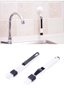 Wall-mounted window groove brush with dustpan, showing front and back structure detail