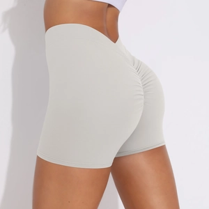 Close-up of light grey high-waisted fitness shorts with scrunch butt lifting detail