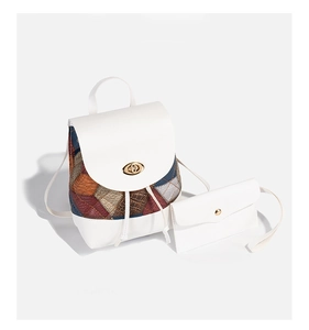 White leather backpack with colorful diamond pattern and matching coin purse set