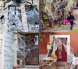 Stretchy white Halloween spider web with black spiders decorating a porch and window