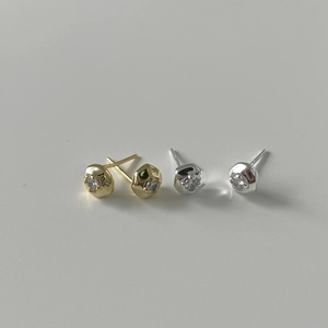 Detailed view of gold and silver S925 sterling silver stud earrings with sparkling zircon stones