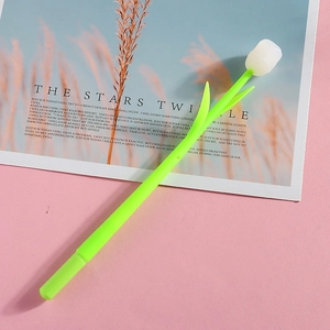 Macro detail of tulip-shaped gel pen with light-changing silicone petals on pink background