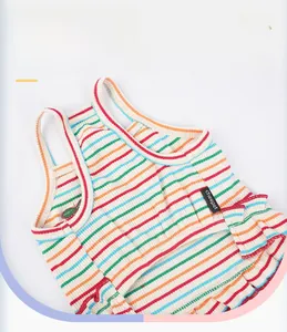 Close-up of colorful striped dog vest with pink elastic trim and soft ribbed texture