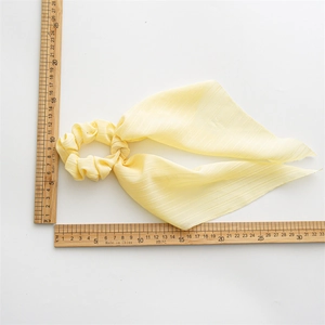Yellow chiffon daisy floral scrunchie with long streamers showing 15x30cm size measurement