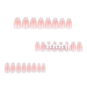 Sweet pink cat-eye press-on nails with 3D white bow charms and glittery gradient finish