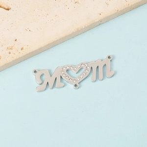 Polished silver MOM letter pendant with sparkling rhinestone heart on light blue background