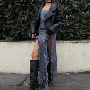 Street style combo of black leather jacket, strapless slit dress and faux croc boots