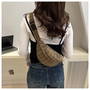 Detailed back view of a brown striped crossbody chest bag with quick-release buckle