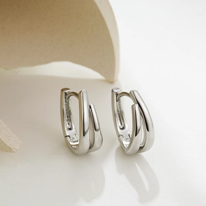 Minimalist silver dual-layered U-shaped hoop earrings with polished metallic finish