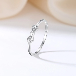 Minimalist S925 sterling silver bow ring with small diamonds for women on white background