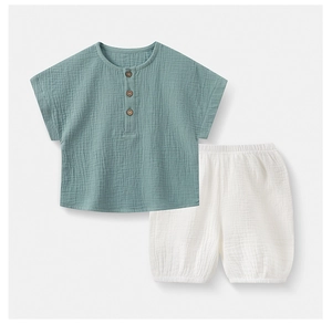 Detail of cotton gauze kids short sleeve pajama set with wooden buttons and soft texture