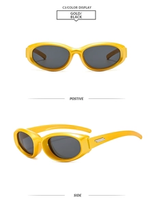 Detail of Y2K oval sunglasses with gold frame and silver rectangular temple accents