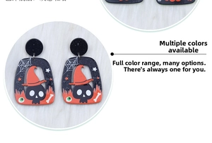 Detail of Halloween acrylic earrings featuring black skull, orange wizard hat, and spider web