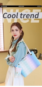 Close-up of rainbow gradient tote bag with heart quilting and golden hardware details