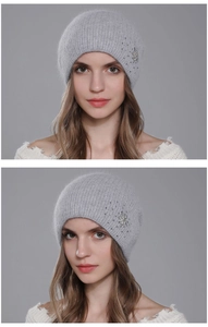 Close-up of grey Angora knit beanie with sparkling rhinestone snowflake detail and rib texture