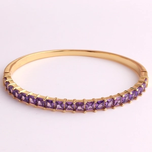 Close-up of 18K gold plated bangle featuring purple square-cut AAA cubic zirconia stones