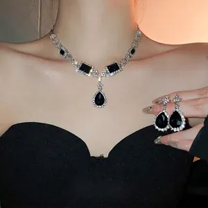 Elegant deep blue sapphire waterdrop necklace and earrings set with crystal pavé accents