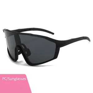 Oversized matte black cycling sunglasses with aerodynamic wrap design for outdoor sports