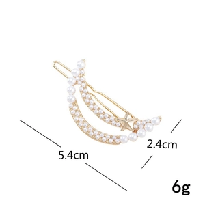 Detail view of crescent moon hair clip with white pearls and crystals, size 5.4cm x 2.4cm