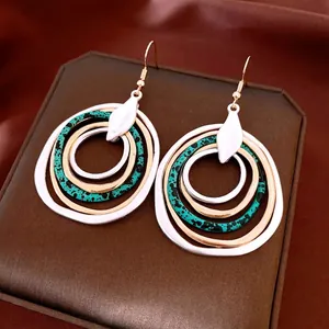 Bohemian multi-layer concentric circle earrings with silver and gold textured rings