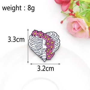 Detailed size view of a heart skeleton floral brooch with 3.3cm height and 3.2cm width