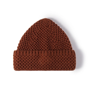 Women's dark brown chunky knit beanie featuring a thick cuffed rim for winter warmth