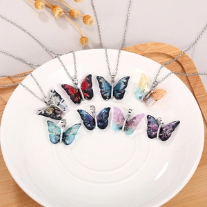 Colorful acrylic butterfly necklace set with shimmering gradient wings and silver chain