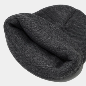 Thick charcoal grey ribbed knit beanie for winter warmth with a minimalist outdoor style