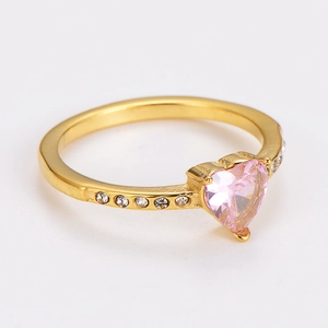 Close-up of gold-plated heart ring with pink zircon center and small white stones