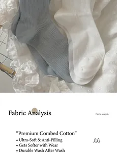 Detail of white and light blue ribbed cotton crew socks on soft lace fabric background