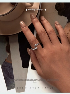 Detailed view of adjustable 925 sterling silver ring with unique hug hand design on hand