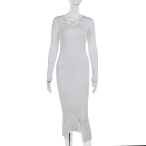 Detailed close-up of white ribbed knit dress featuring a cross strap V-neck and slim fit cut