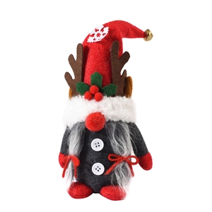 Christmas gnome doll with red hat, reindeer antlers, and gray beard on white background