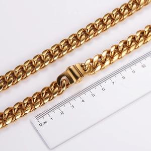 Detail shot of a 10mm wide gold stainless steel Cuban link chain measured with a ruler