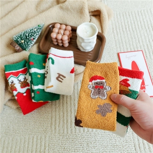 Thick warm coral fleece Christmas socks featuring reindeer and gingerbread man patterns