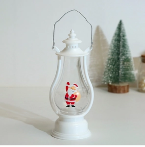 Close-up of a white Christmas lantern featuring a Santa Claus figure and LED candle light