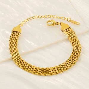 Detail of 18K gold-plated woven chain bracelet featuring K18 engraved tag and lobster clasp