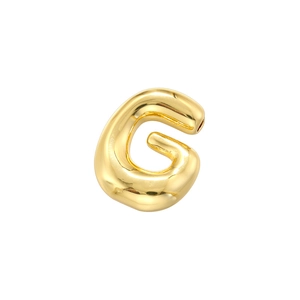 Close-up of high-polished gold bubble letter G pendant with minimalist metallic texture