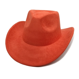 Detail of bright orange faux suede texture on a classic western style cowboy hat