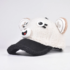 Detail of plush lamb wool baseball cap with cute puppy eyes and soft brown ears