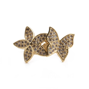 Golden double butterfly open ring with white zircon stones on a clean white background