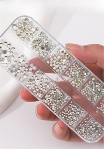 Detail of 12-grid storage box with diverse nail art rhinestones and crystal decorations