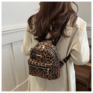 Leopard print mini backpack for women featuring golden zippers and adjustable straps